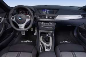 E84_X1_carbon_interior_steering_wheel_pedals_gear_knob_handbrake_handle_iDrive Cover_floor_mats_300
